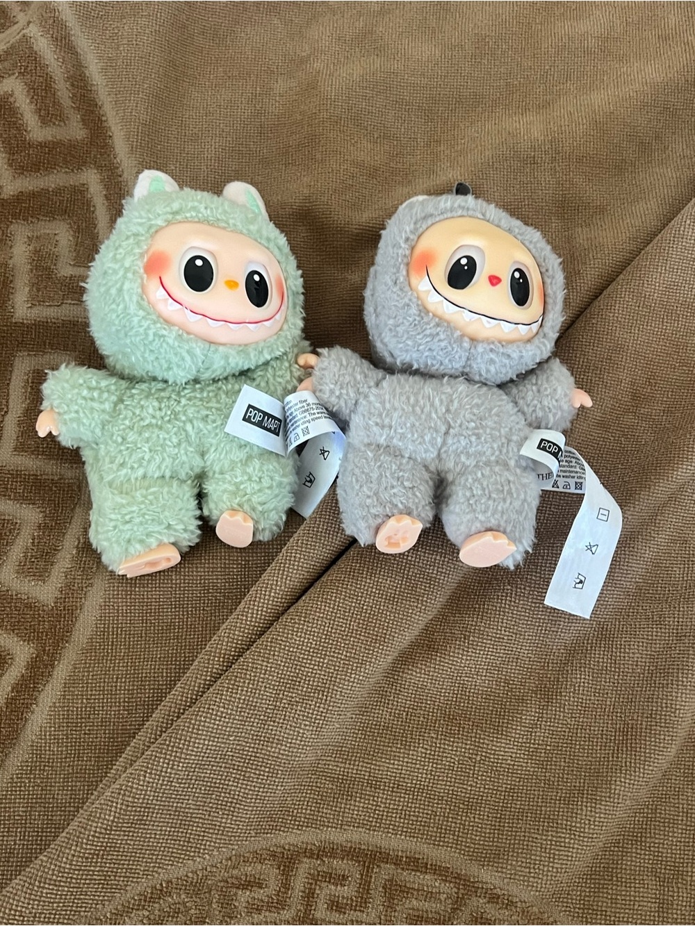 Labubus the monsters that are green and gray